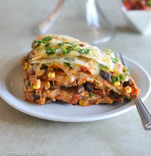 A cheesy, hearty slice of an enchilada bean torte