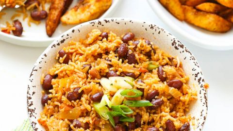 Fried rice with beans served with plantains
