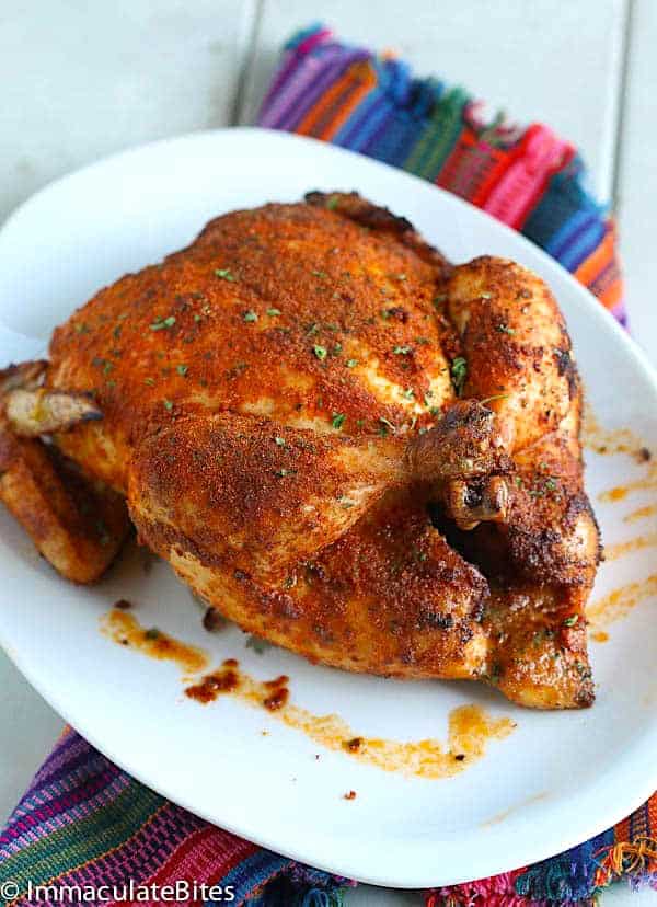A whole chicken fresh from the oven spiced up with East African flavors
