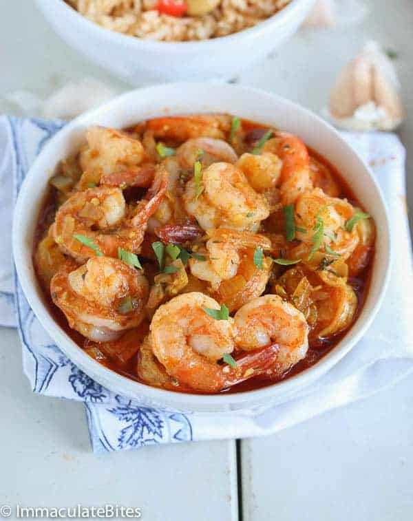Serving up a bowl of freshly prepared Caribbean curried shrimp