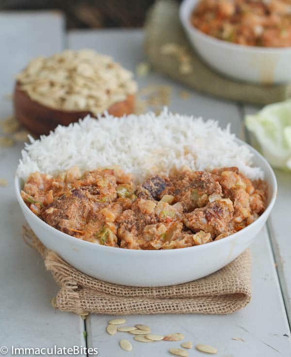 Enjoying cabbage egusi soup with rice for an African comfort food meal