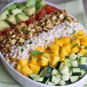 A gorgeous Mediterranean salad with couscous, mango, and corn