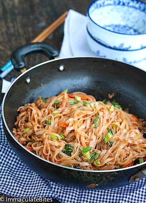 A skillet full of pork noodles, ants climbing a tree