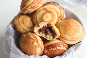 A basket full of delightfully light Aebleskiver Danish Pancakes