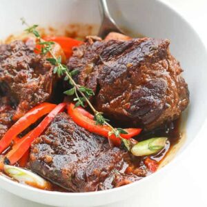 Jamaican Brown Beef Short Ribs Stew ready to enjoy with polenta on the side