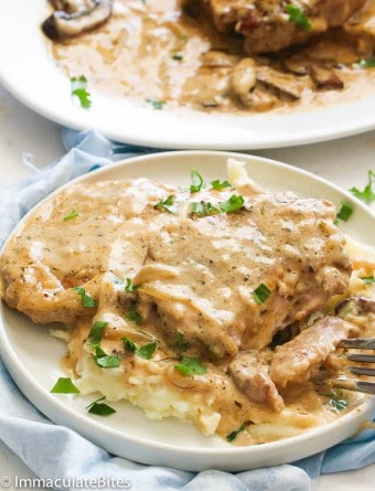 Slow Cooker Pork Chops - Immaculate Bites