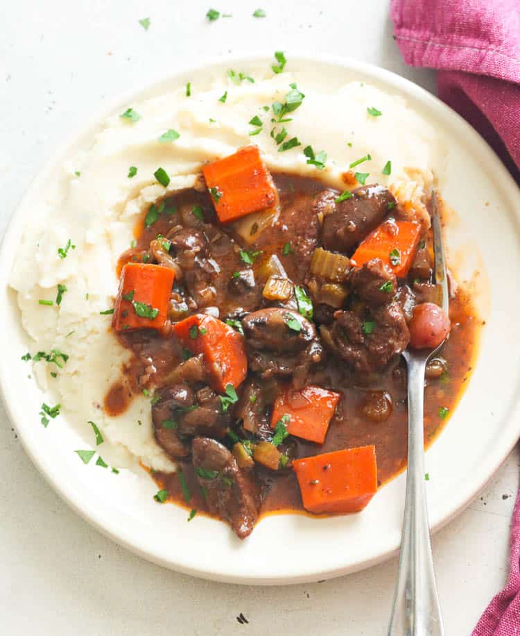 Beef Bourguignon served on top of Garlic Mashed Potatoes