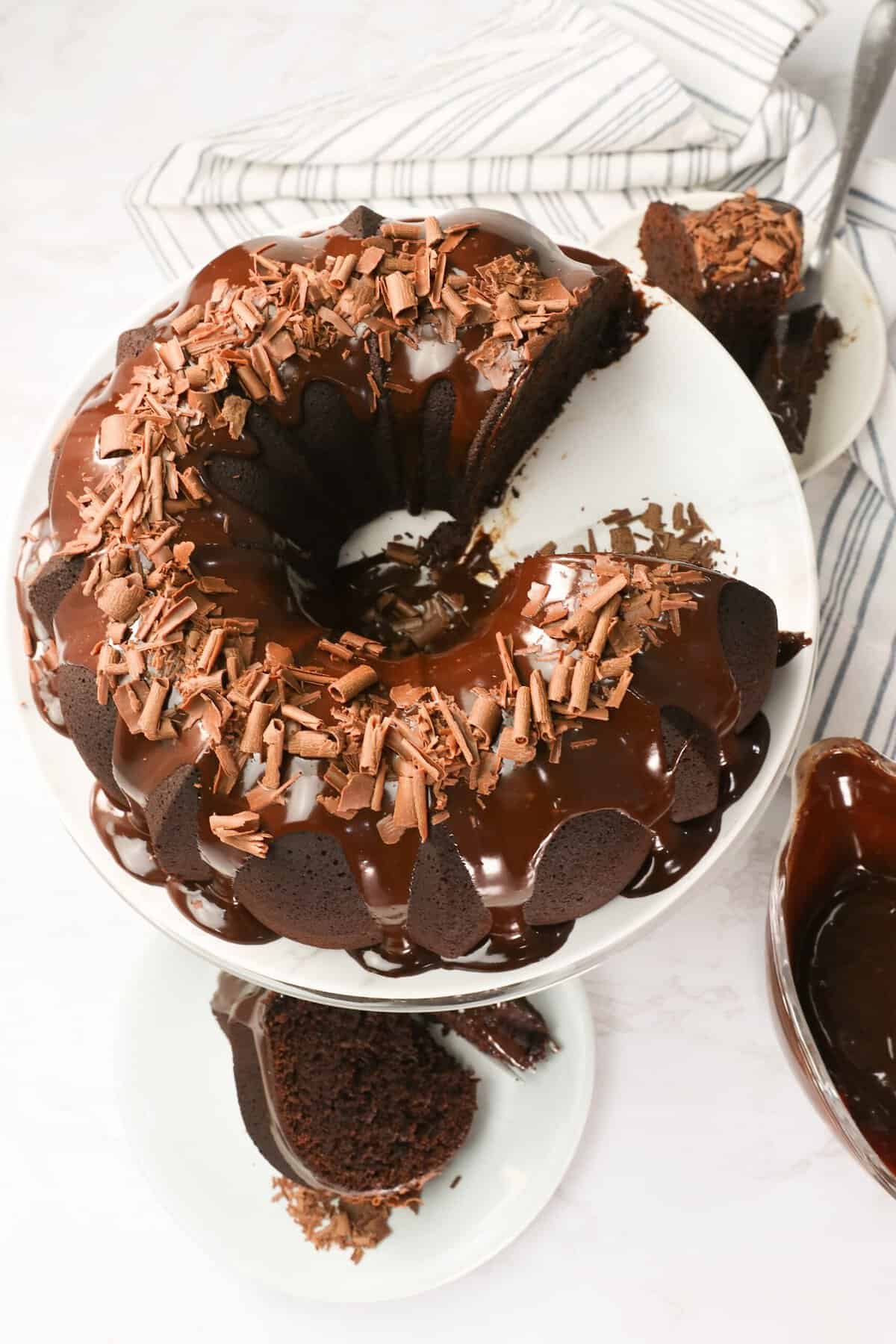 Serving up a slice of freshly frosted chocolate bundt cake for an easy special occasion dessert