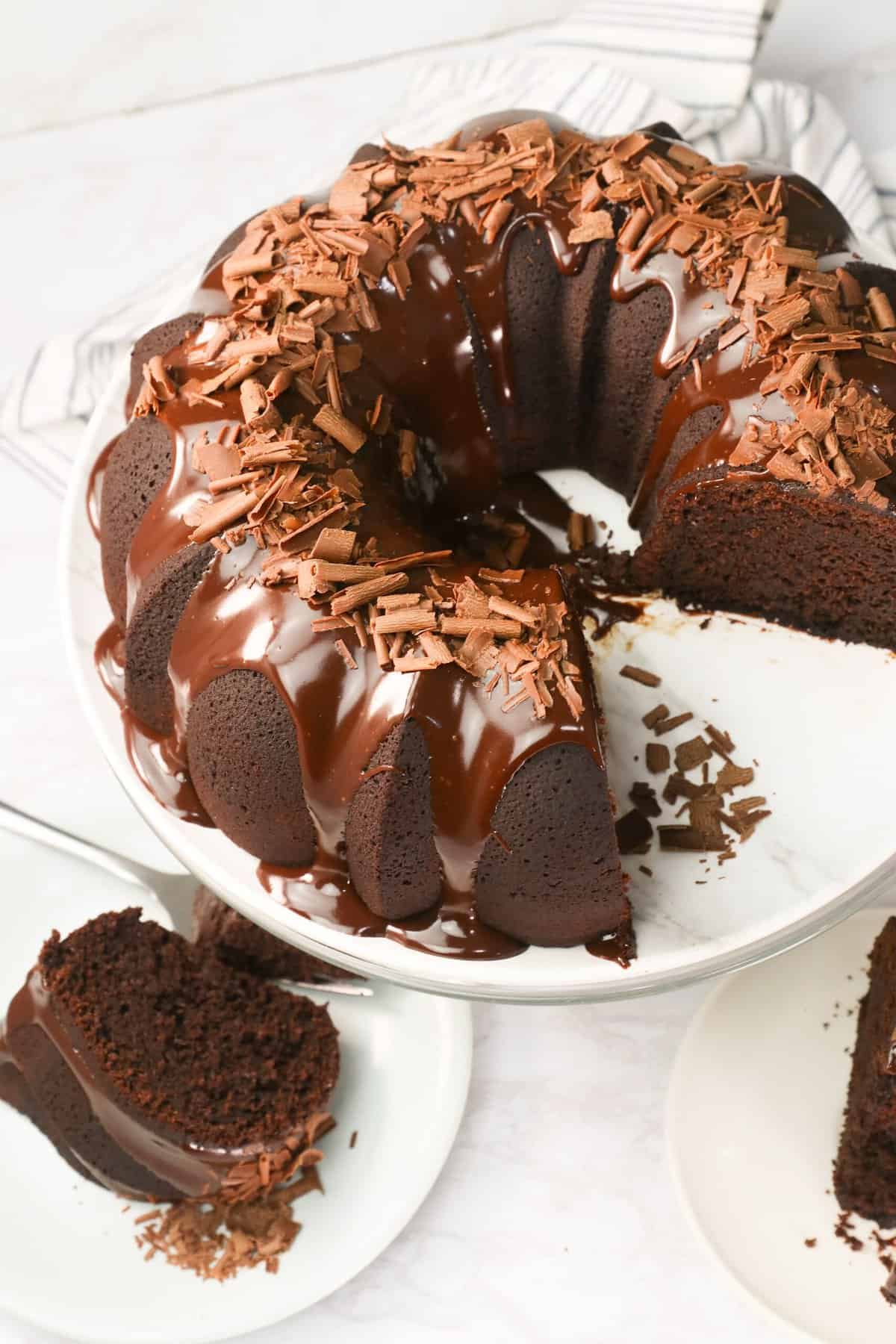 Slicing up to serve a ridiculously delicious and sweet tooth satisfying chocolate bundt cake