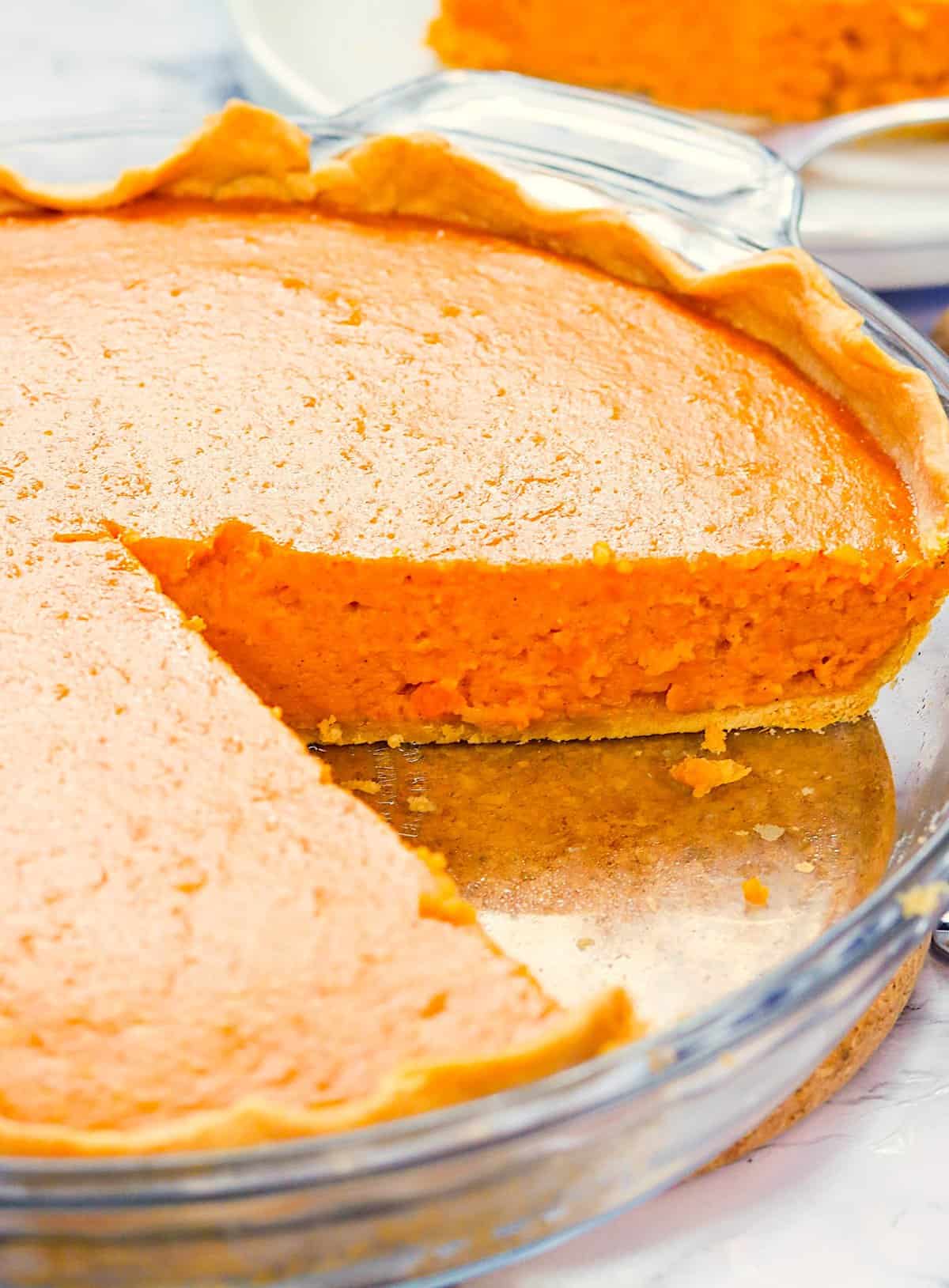 A freshly made Condensed Milk Sweet Potato Pie sliced and ready to serve