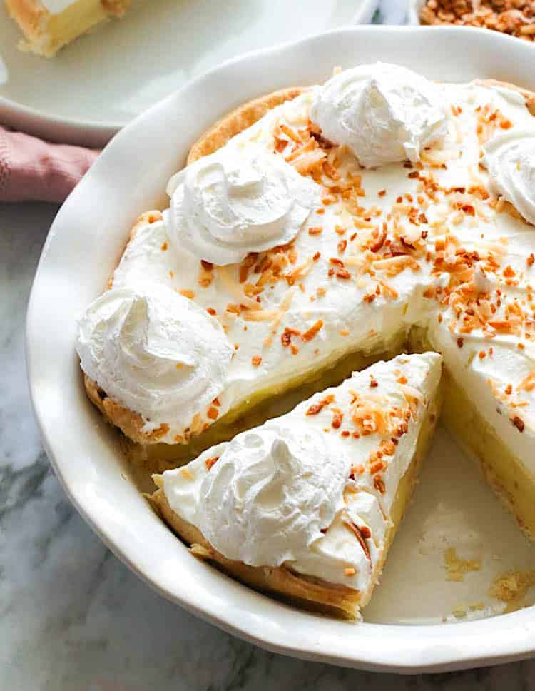 Serving up soul satisfying coconut cream pie topped with homemade whipped cream and toasted coconut