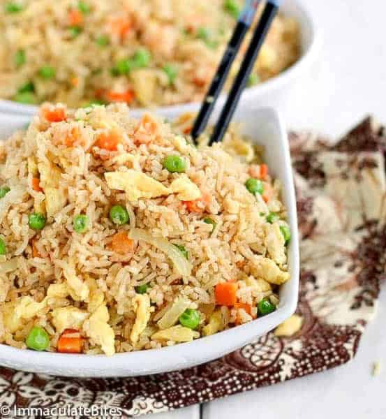 Enjoying delicious coconut fried rice with chopsticks