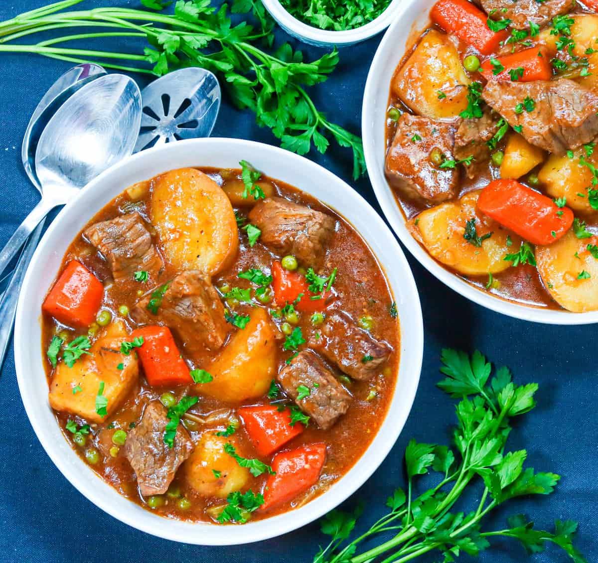 Two bowls of braised beef stew made in a Dutch oven will leave you feeling satisfied