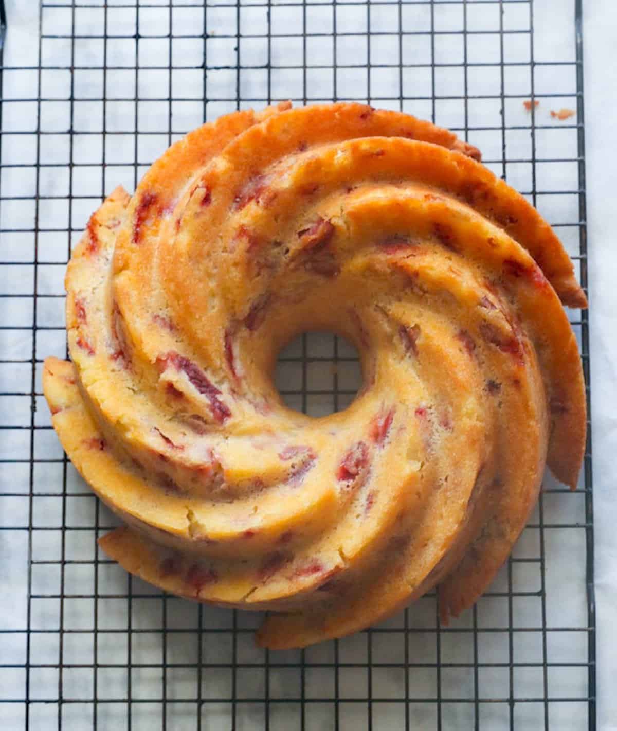 Freshly baked strawberry bundt cake ready to be glazed