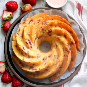 Glazing a gorgeous Strawberry Bundt Cake for pure comfort food