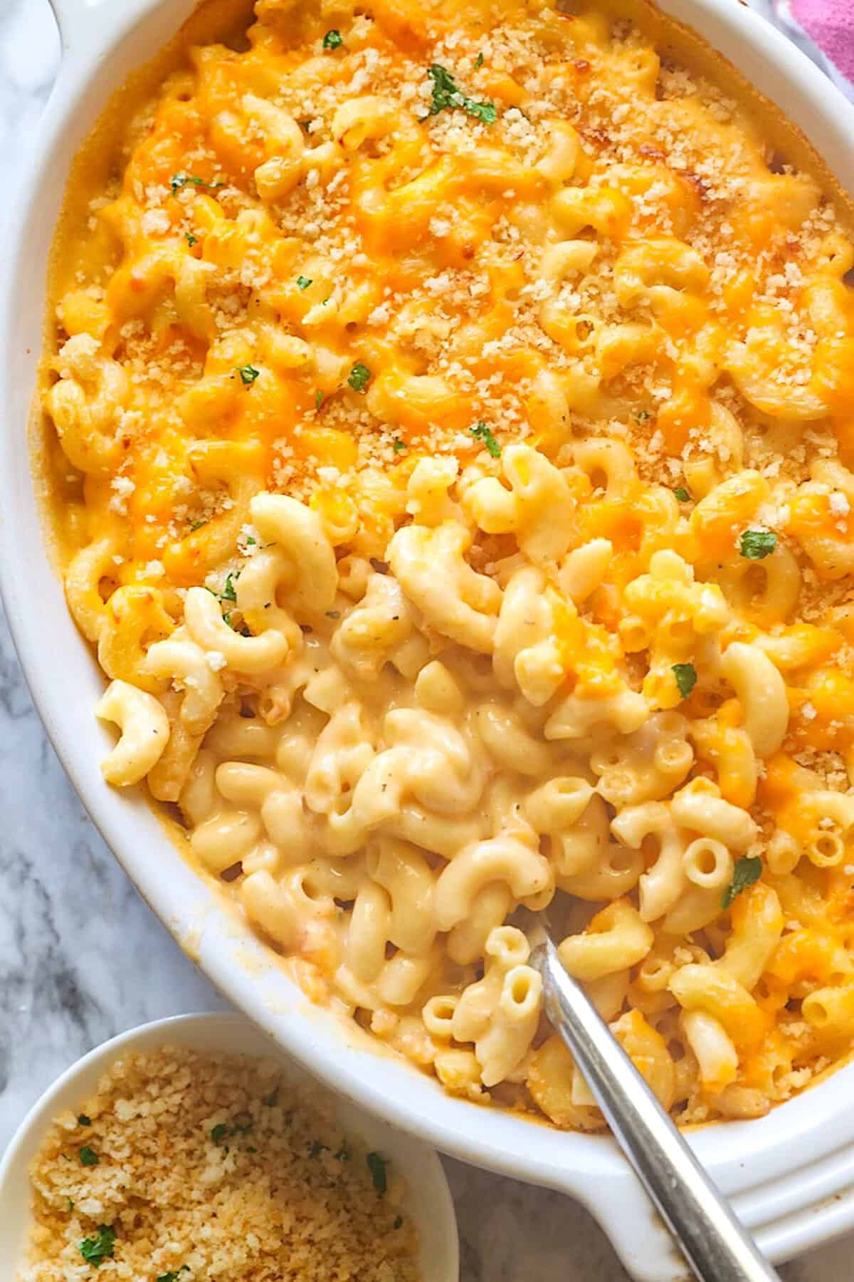 Spooning up a serving for melty, creamy Velveeta mac and cheese