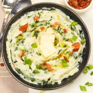 Enjoying a huge bowl of colcannon potatoes topped with green onions and bacon