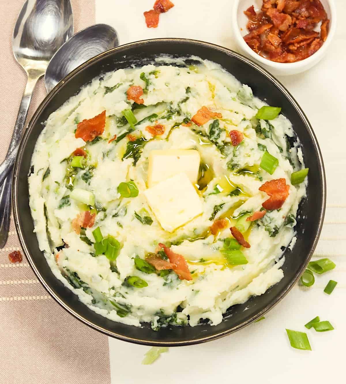 Enjoying a huge bowl of colcannon potatoes topped with green onions and bacon