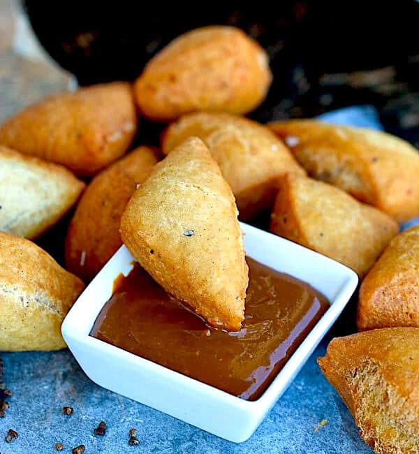 Dipping a soft and decadent mandazi in caramel sauce