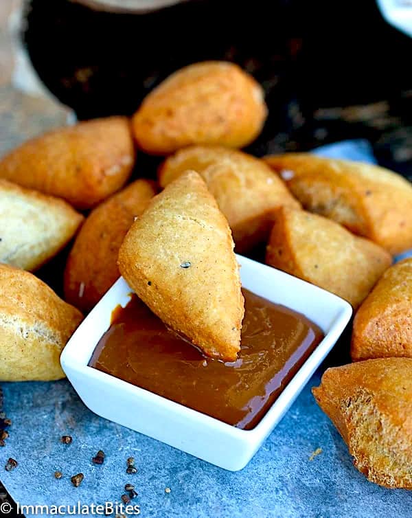 Dipping a soft and decadent mandazi in caramel sauce