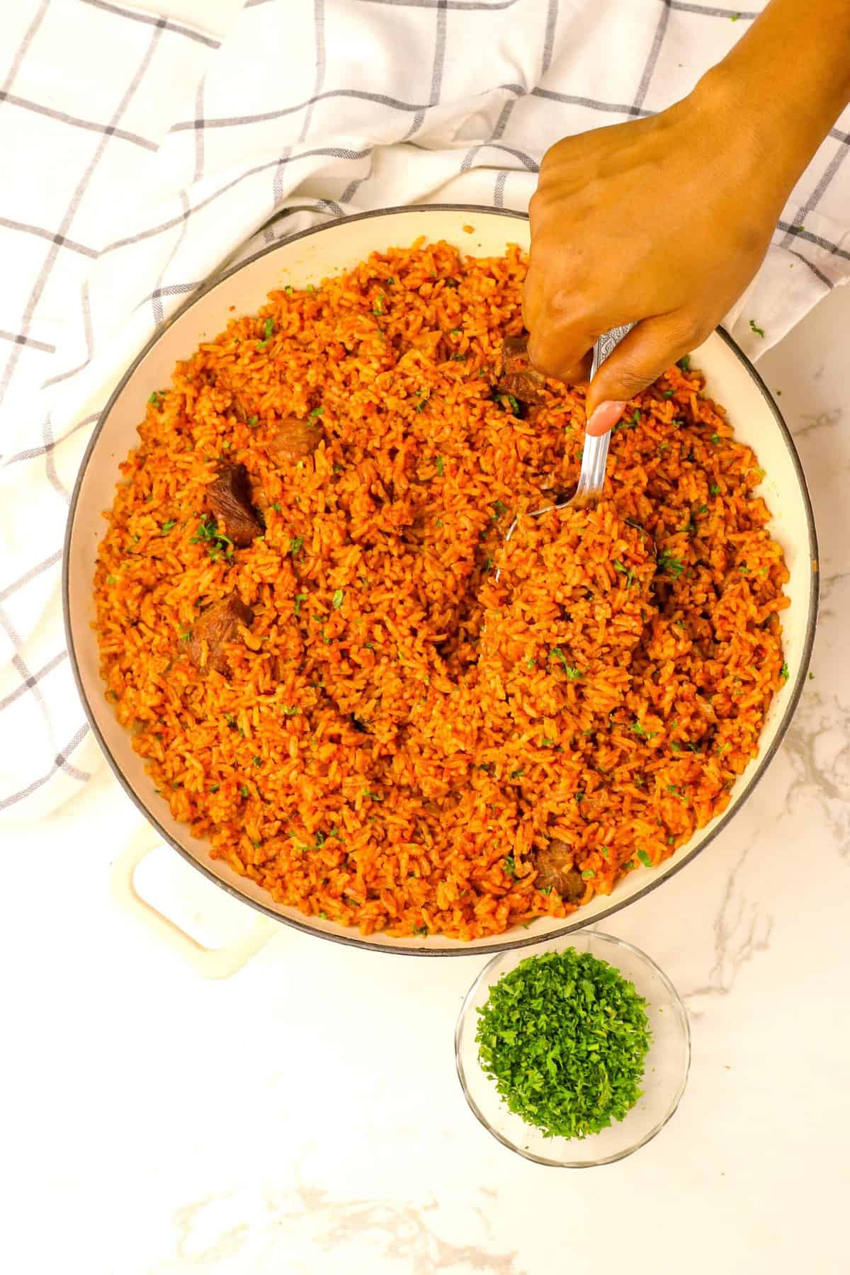 A finished bowl of Ghanaian jollof rice for a hearty side or one-pot meal