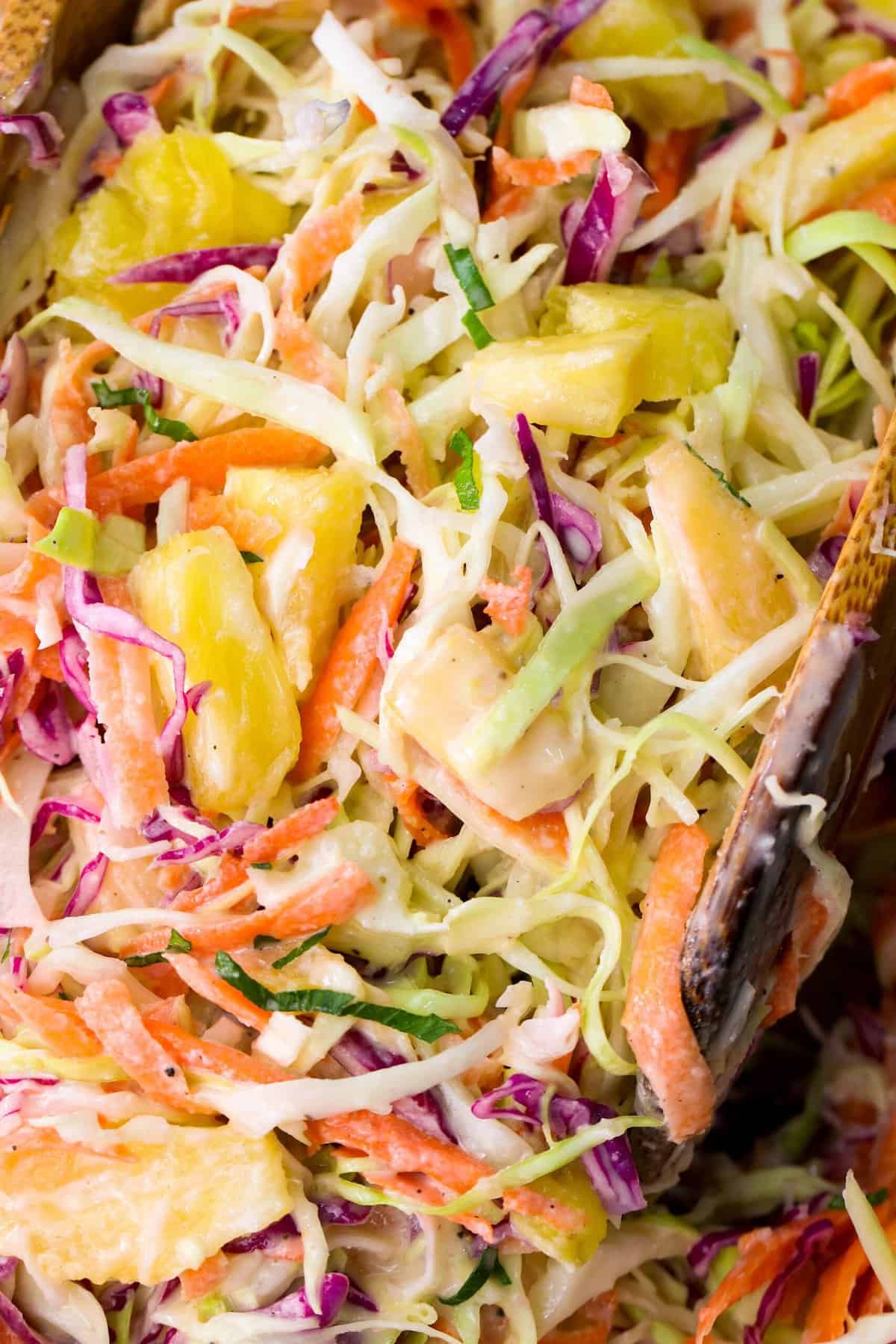 A delectable closeup of pineapple coleslaw with a rainbow of color