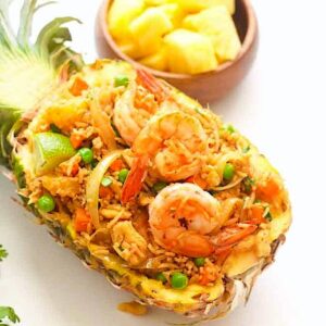 Enjoying pineapple fried rice on the pineapple half shell