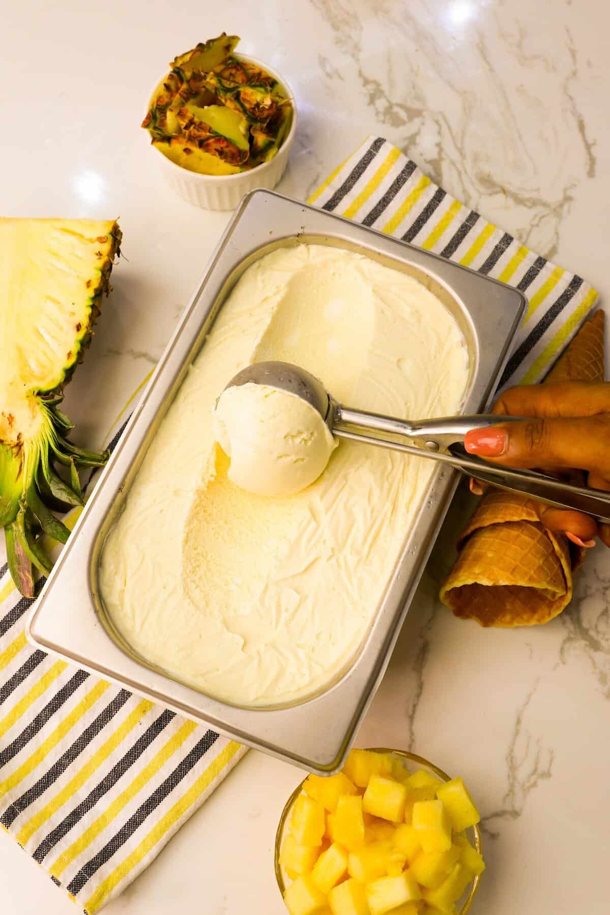Scooping up homemade pineapple ice cream for a refreshingly tropical treat