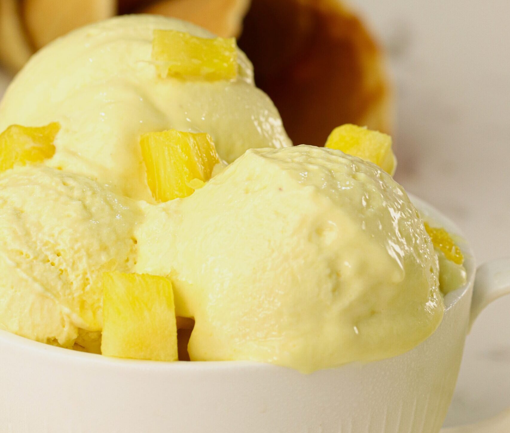 Enjoying a bowl of homemade pineapple ice cream, no ice cream maker involved