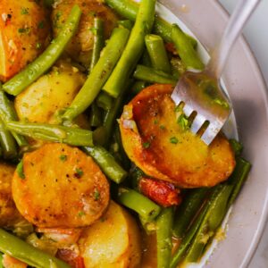Diving a fork into nutritious and comforting green beans and potatoes