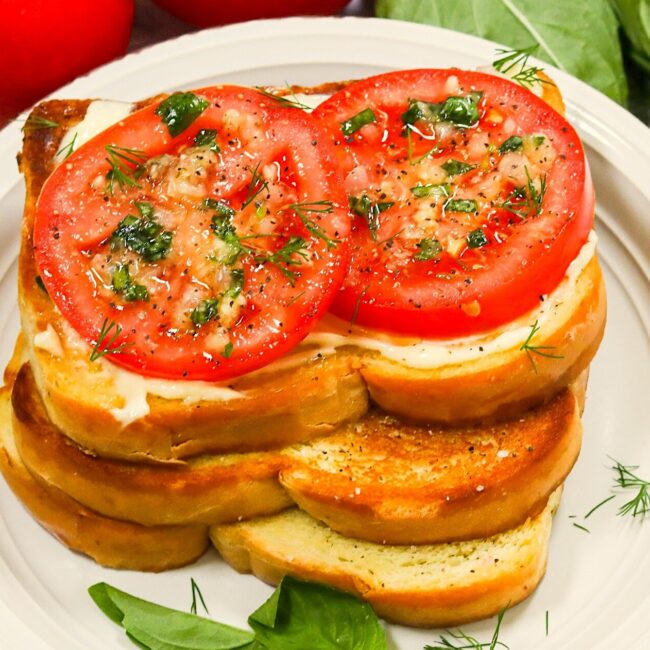 Enjoying a Southern tomato sandwich, one as a classic and the other open-face