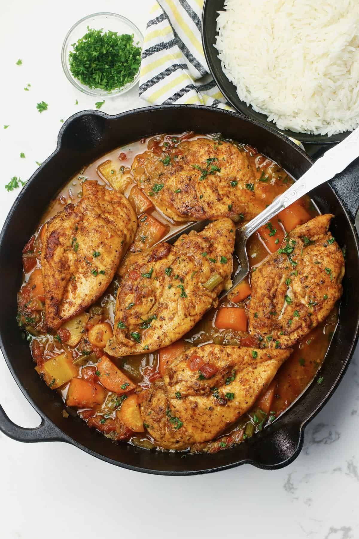 Serving up fresh from the oven braised chicken breasts in a flavorful braising sauce