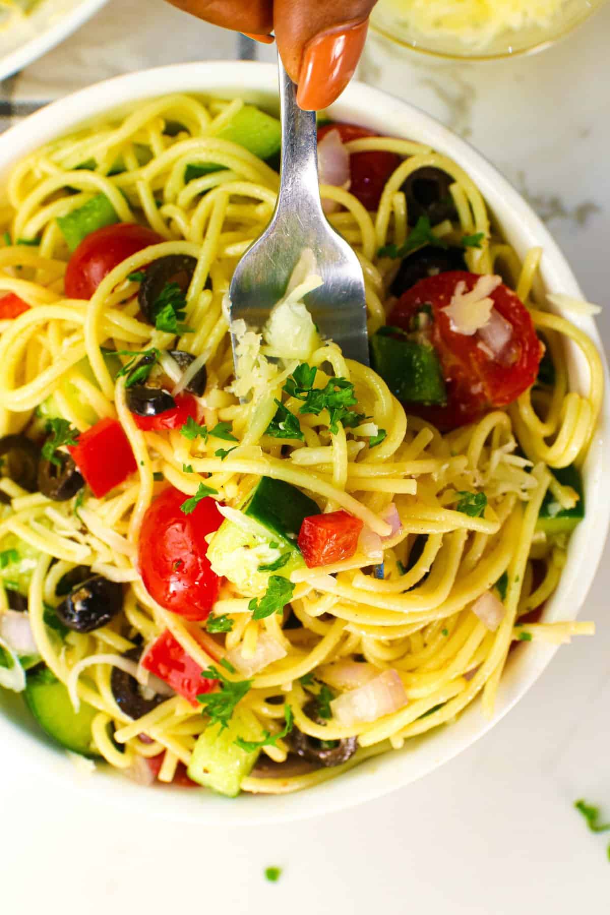 Diving into an insanely delicious California spaghetti salad with a fork