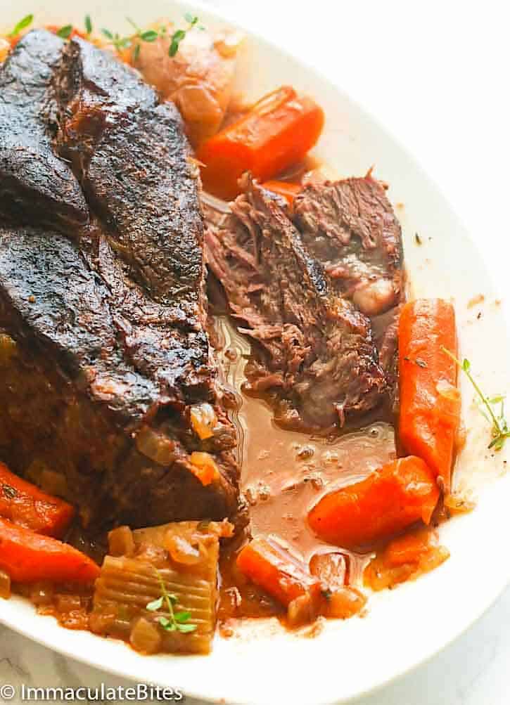 Tearing into deliciously comforting slow cooker pot roast for an easy weeknight dinner