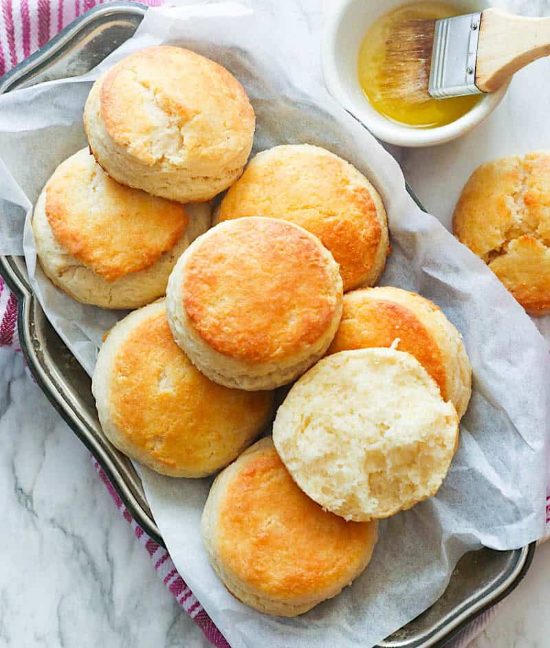 Breaking open freshly baked butter biscuits