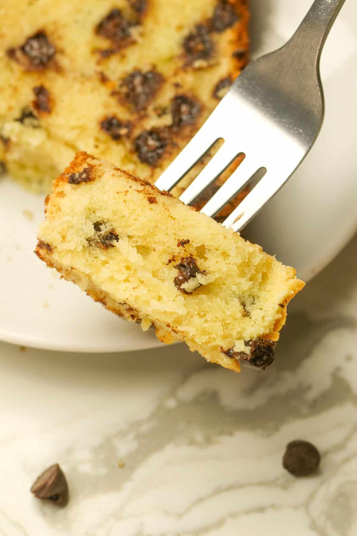 Taking a decadent bite out of a slice of chocolate chip pound cake