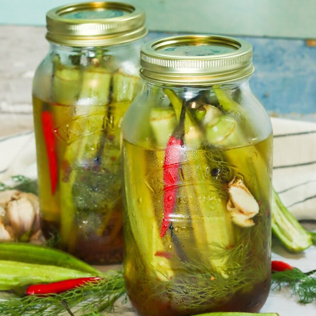 Two jars of pickled okra ready to enjoy with your favorite sandwich