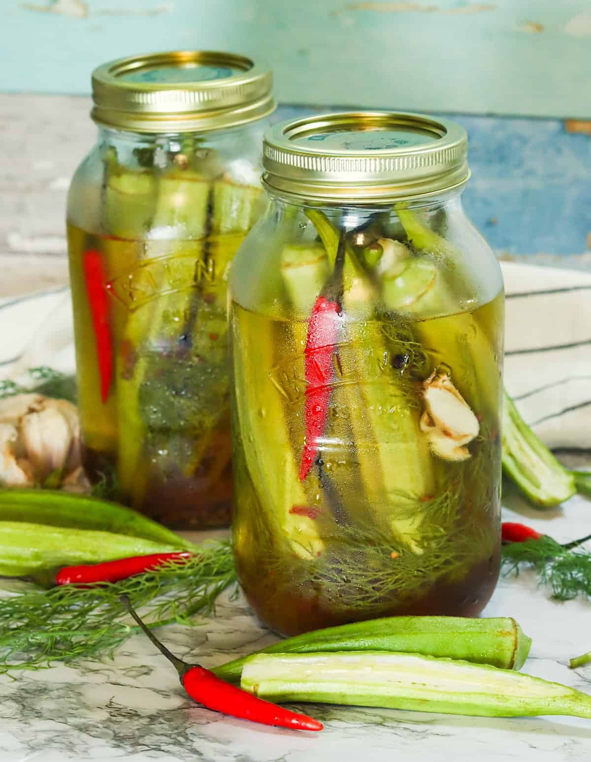 Two jars of pickled okra ready to enjoy with your favorite sandwich