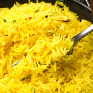 Diving into a gorgeous yellow bowl of saffron rice