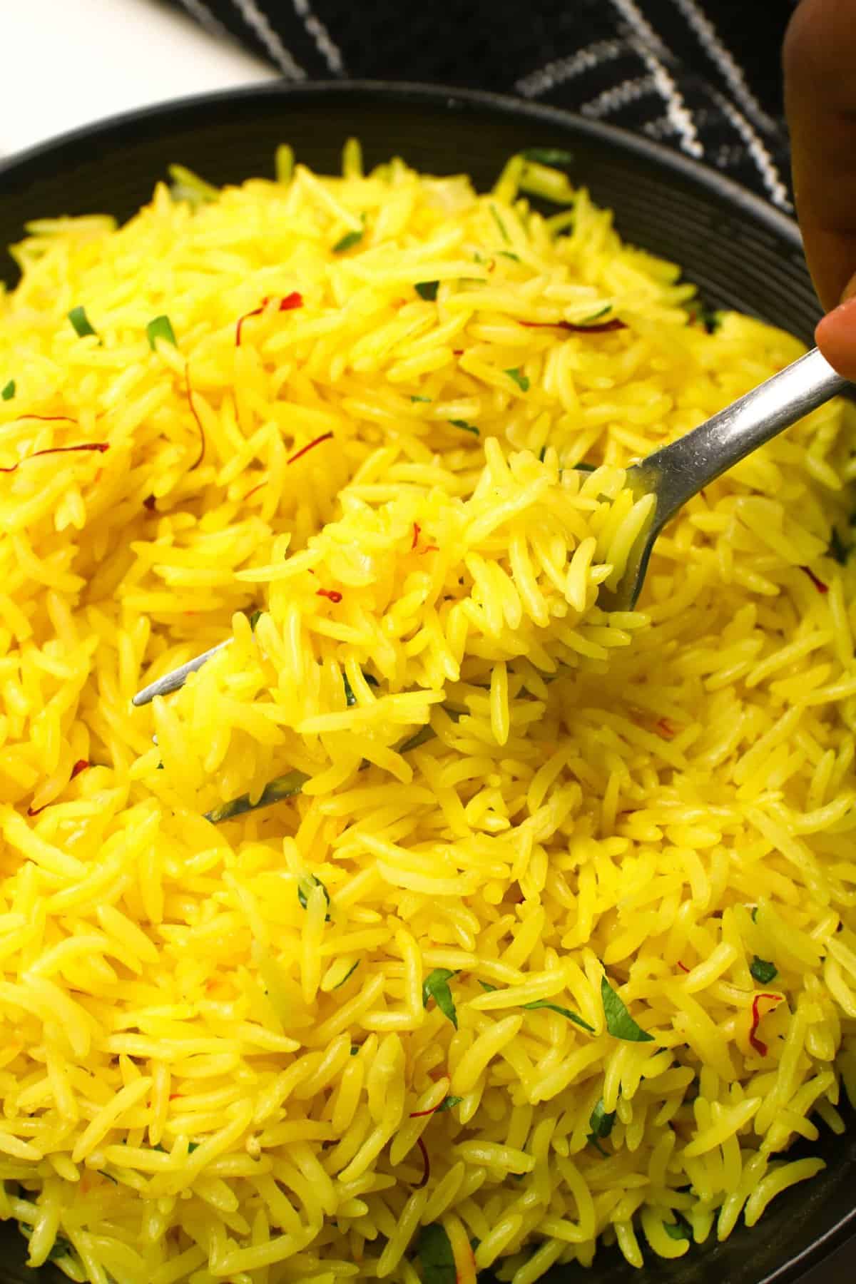 Diving into a gorgeous yellow bowl of saffron rice