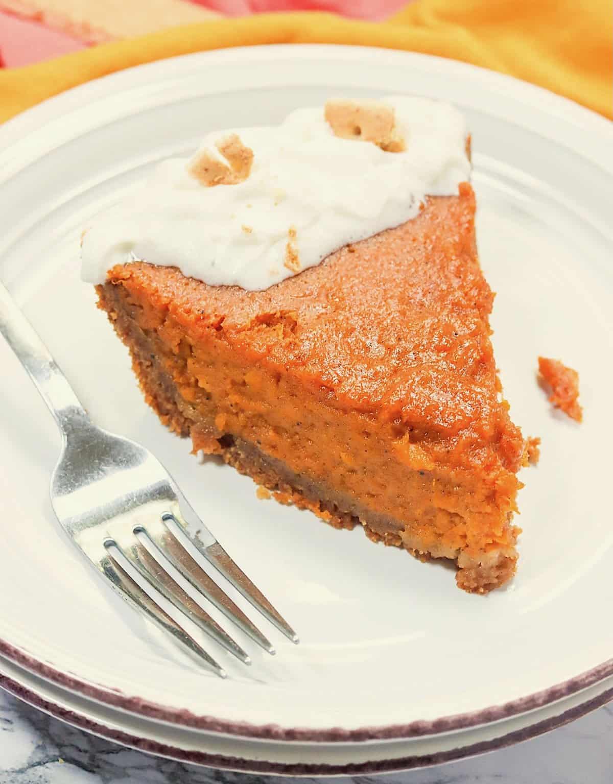 Diving into an insanely good slice of sweet potato pie in a graham cracker crust