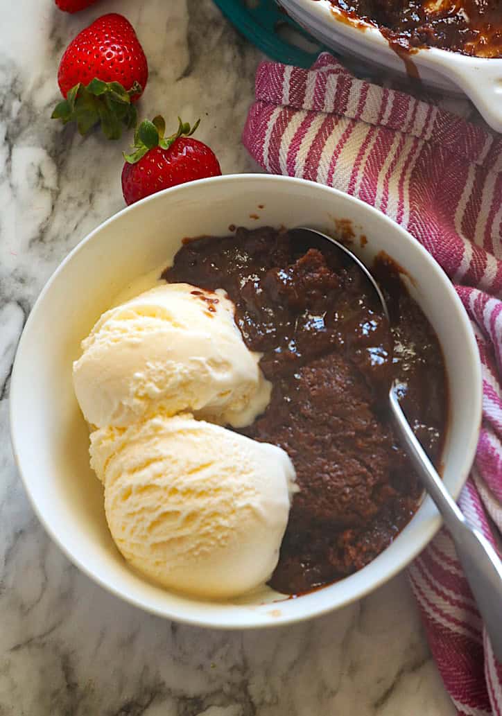 Serving up warm chocolate cobbler with vanilla ice cream