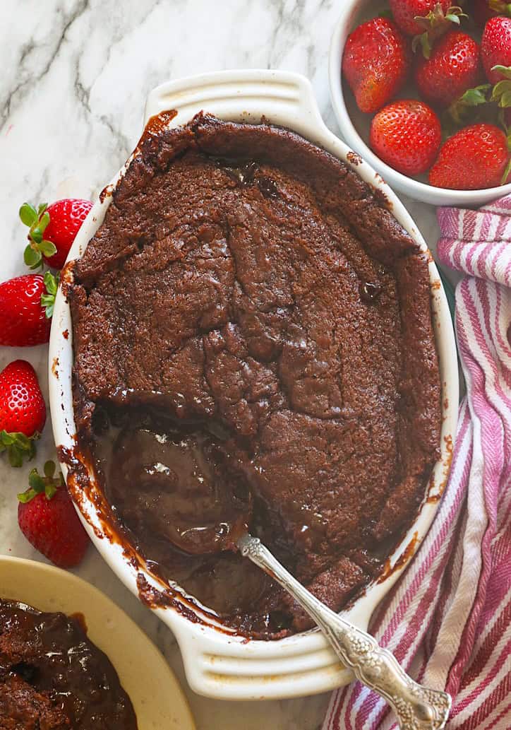 Serving up decadent chocolate cobbler with fresh strawberries