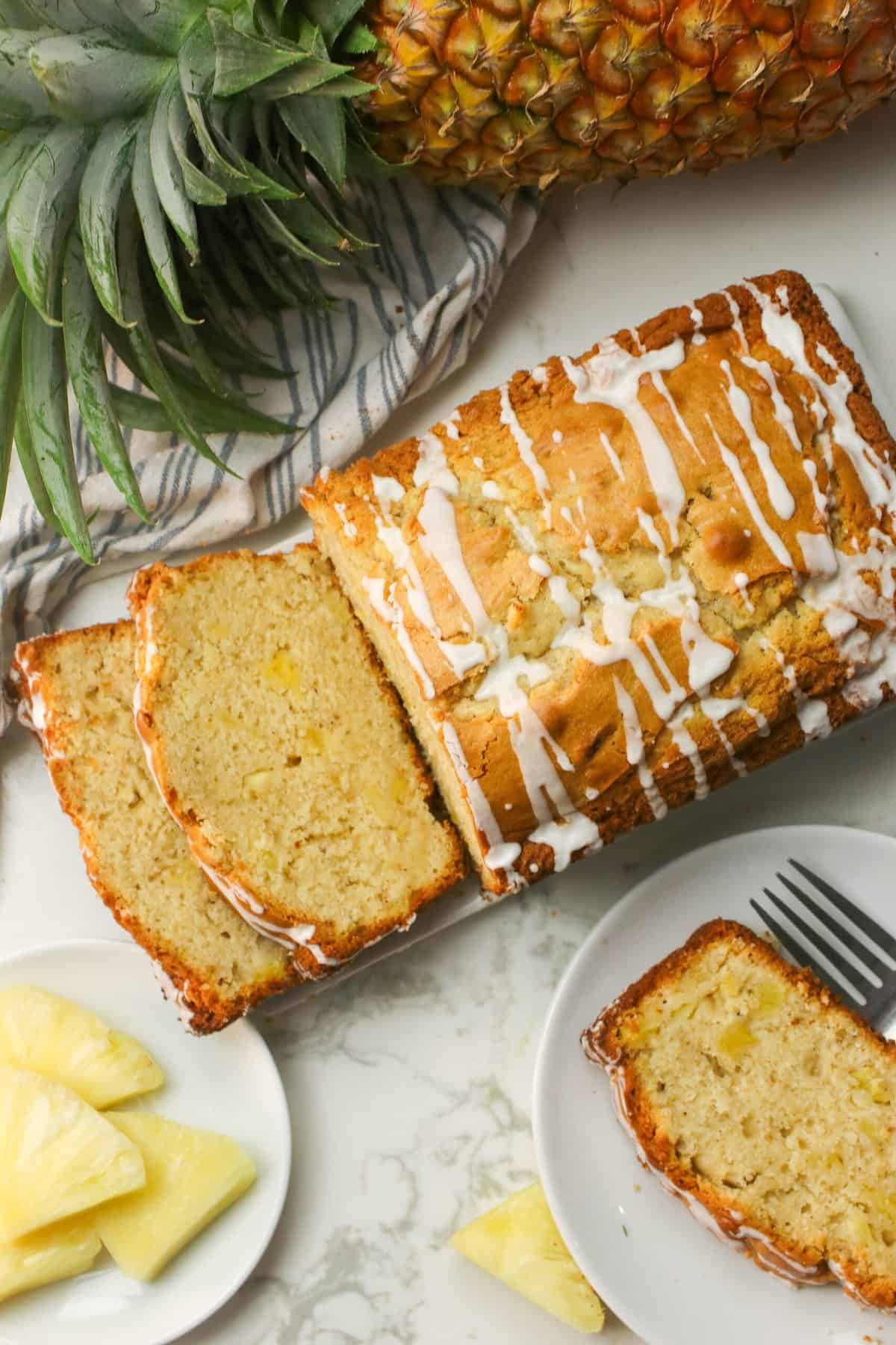 Slicing freshly glazed pineapple bread for a delectable afternoon snack