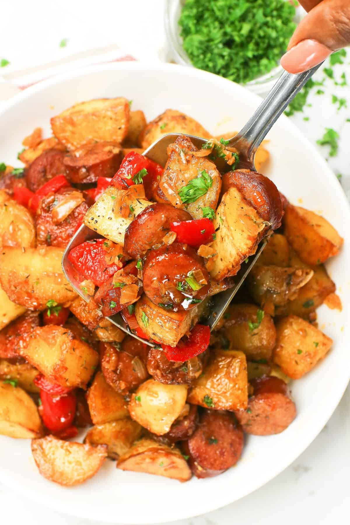 Enjoying sausage and potatoes hot off the stove