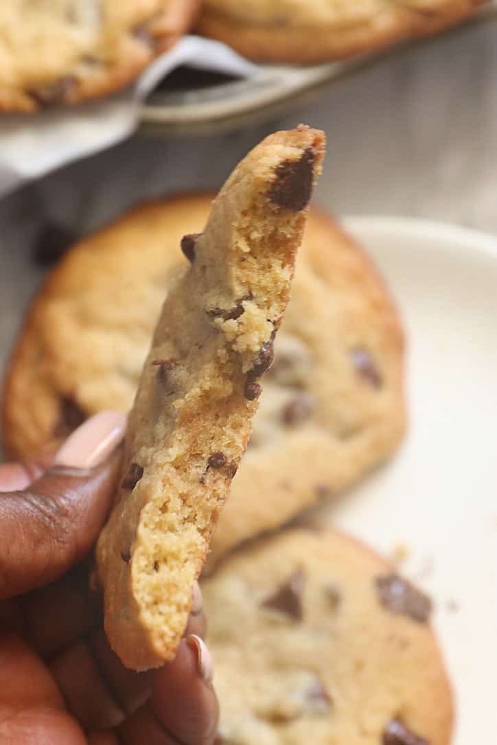 Breaking open a soft and chewy chocolate chip cookies