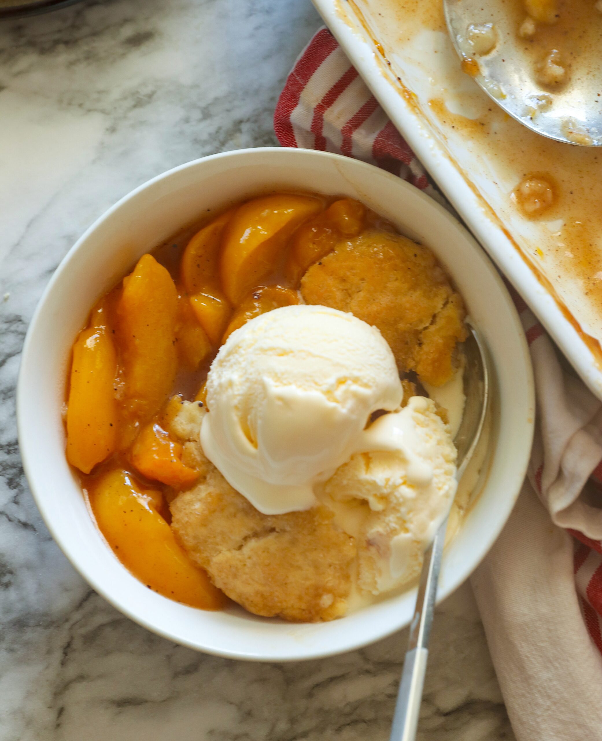 Warm and comforting peach cobbler made even easier with canned peaches