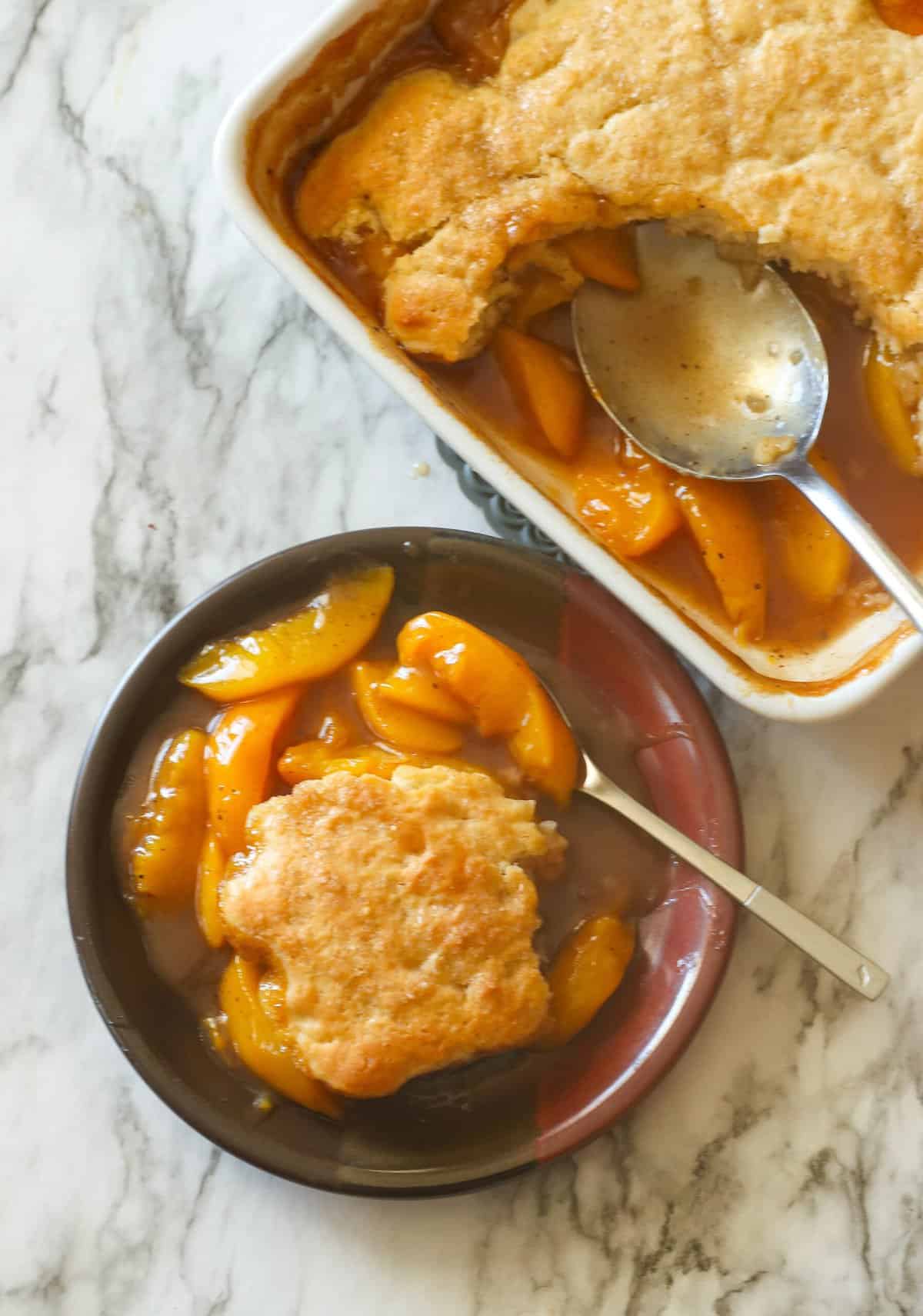 Serving up insanely good peach cobbler with canned peaches