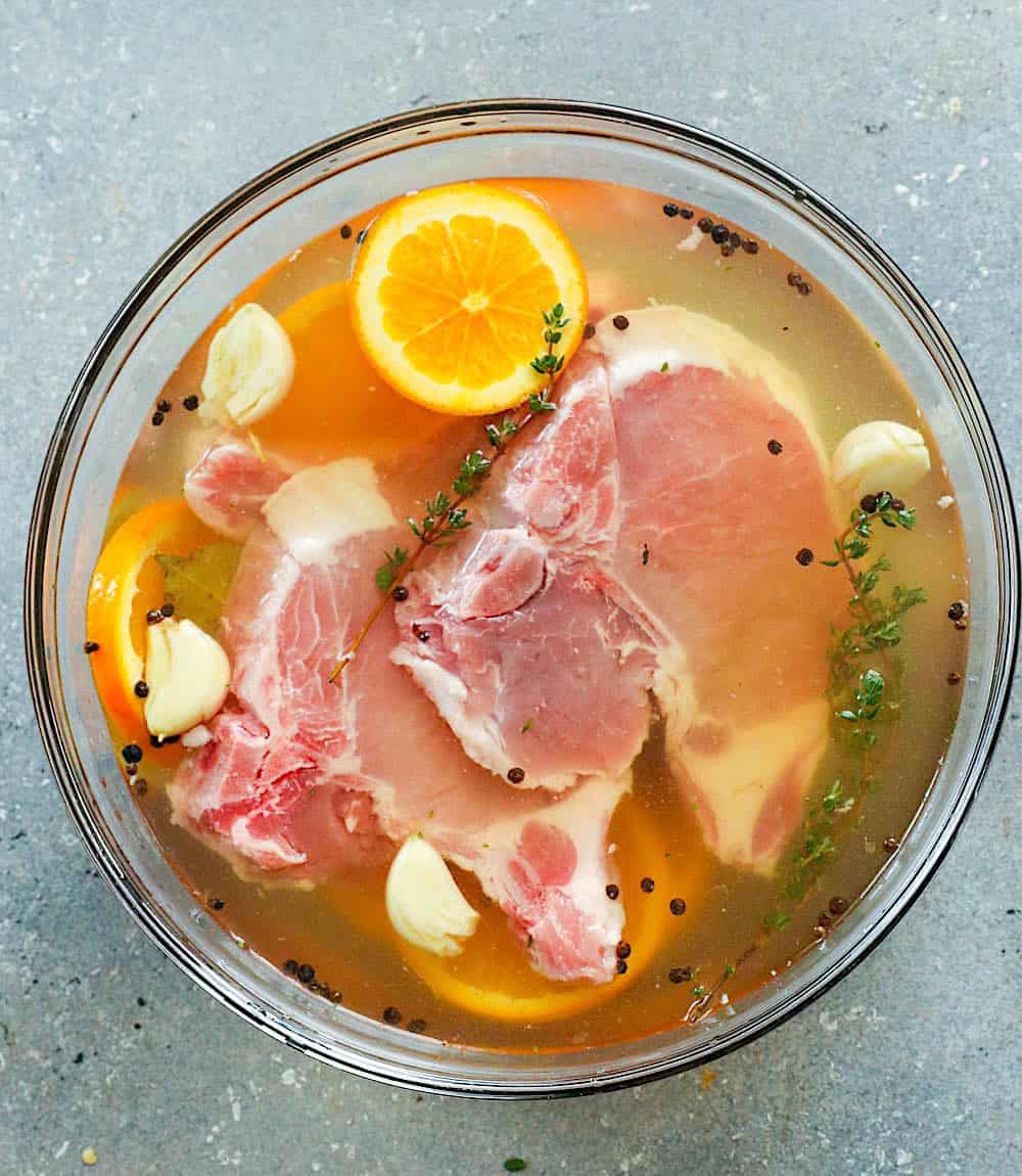 Pork chops brining for an extra tender and juicy dinner