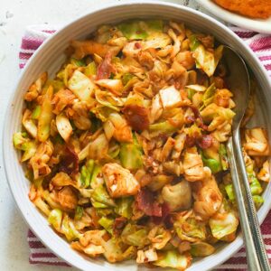 Serving up a bowl of freshly Southern fried cabbage with hot water cornbread